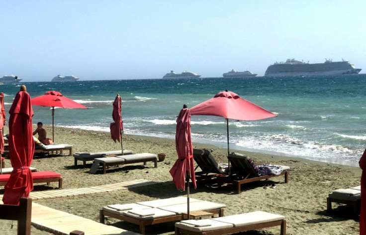 A line of international cruise ships stand idle anchored off the coast of the Cypriot resort of Limassol in the eastern Mediterranean