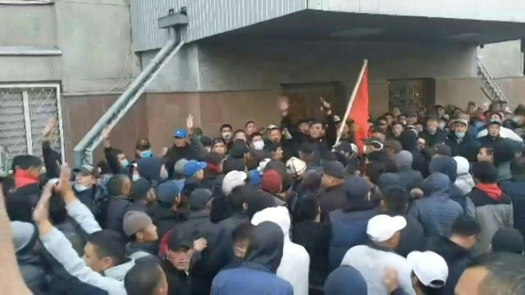 Supporters and critics of self-proclaimed Kyrgyzstan PM Sadyr Japarov gather outside the parliament.