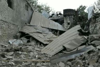 IMAGES Buildings are destroyed in the self-proclaimed capital of Nagorno-Karabakh, Stepanakert, after days of shelling. Half of the population of the breakaway Nagorno-Karabakh region have been displaced since fierce fighting erupted between Armenian sepa