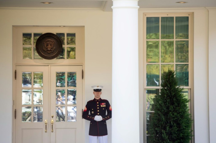 A US Marine stands guard outside the West Wing, indicating that US President Donald Trump is in the Oval Office, at the White House