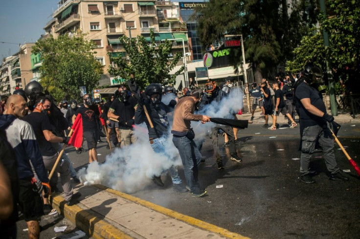 The Athens verdicts came as police and anti-fascist demonstrators clashed outside the courthouse where 15,000 people had gathered