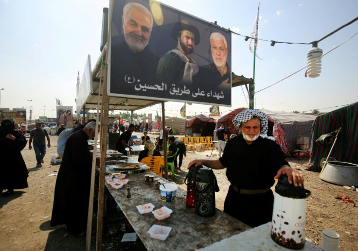 Huge portraits of slain Iranian general Qasem Soleimani and his Iraqi lieutenant Abu Mahdi al-Muhandis adorn the refreshment stalls set up for Shiite pilgrims on the main routes to Karbala