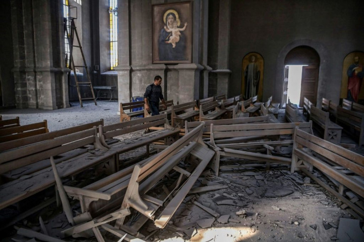 The floor is strewn with rubble after an attack on Ghazanchetsots (Holy Saviour) Cathedral in the historic city of Shusha, on the outskirts of the disputed Nagorno-Karabakh province's capital Stepanakert