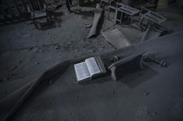A Bible lies open on the altar inside the damaged cathedral, the diocesan seat and of major symbolic importance for Armenians