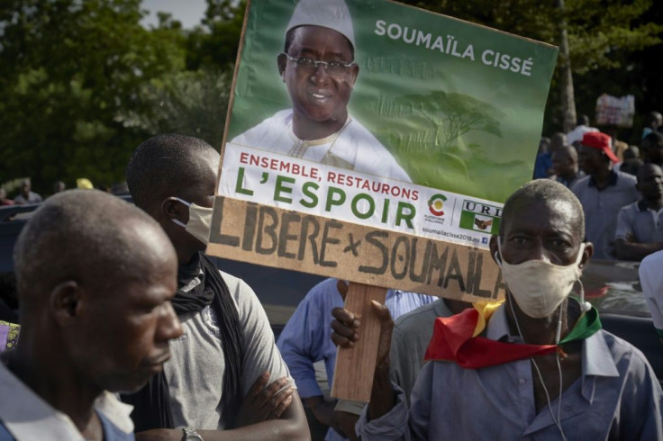 A man holds a sign reading "Release Soumaila" during a July 2020 protest in Bamako calling for the release of Mali opposition leader Soumaila Cisse, kidnapped in central Mali on March 25, 2020