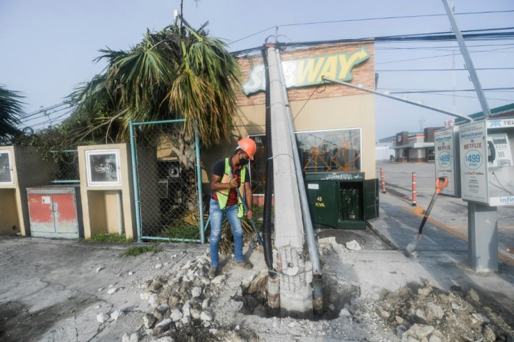 Hurricane Delta knocked down street lamps and uprooted trees when it hit Cancun on Mexico's Caribbean coastline