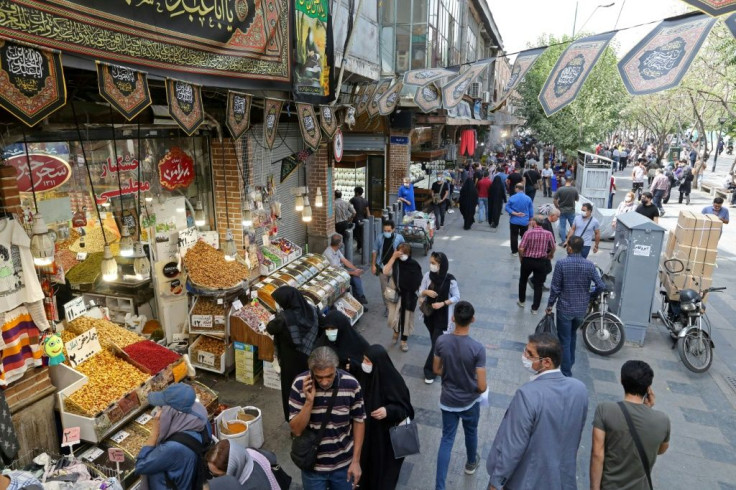 Iranians shop in the capital Tehran's Grand Bazaar in September 2020 as the economy faces intense US pressure