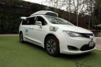 A Waymo self-driving car pulls into a parking lot at the Google-owned company's headquarters in Mountain View, California, in May 2019