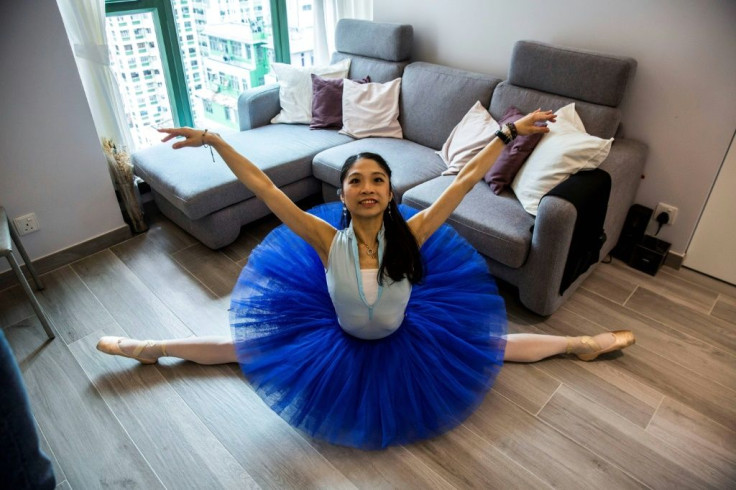 Irene Lo practising in the living room of her Hong Kong flat