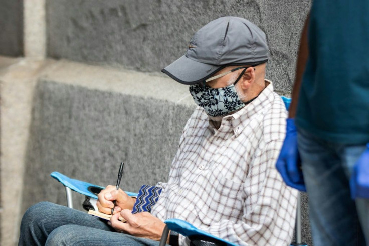 A volunteer observer from the Democratic party watches early voting take place at City Hall in Philadelphia, Pennsylvania on October 7, 2020