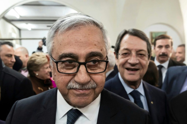 Incumbent Mustafa Akinci, seen here at a UN event with Cyprus President and Greek Cypriot leader Nicos Anastasiades in February, remains wedded to the goal of reunifying the island as a bizonal federation