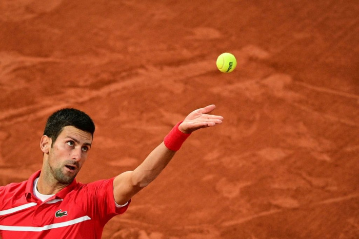 Eye on the ball: Novak Djokovic serves to Stefanos Tsitsipas early in his semi-final