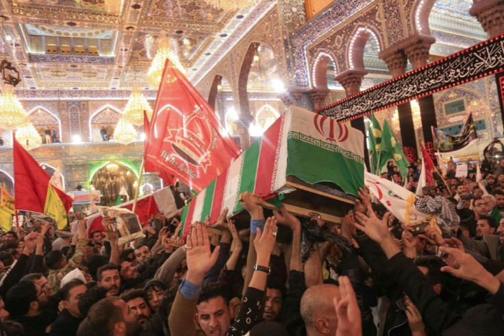 Mourners carry the coffins of Iraqi paramilitary chief Abu Mahdi al-Muhandis, Iranian commander Qasem Soleimani and eight others inside the Shrine of Imam Hussein in the holy Iraqi city of Karbala in January 2020 after they were killed by a US strike