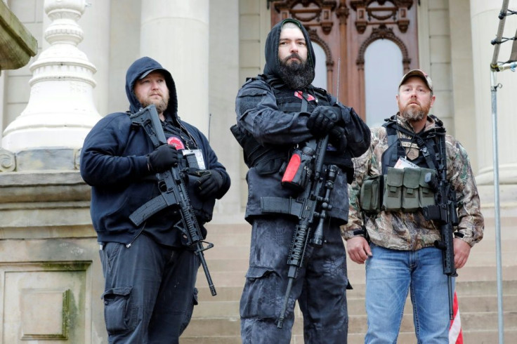 Michael Null (L), one of those arrested in the plot to kidnap Michigan Governor Gretchen Whitmer, at an April 2020 rally against Covid-19 restrictions
