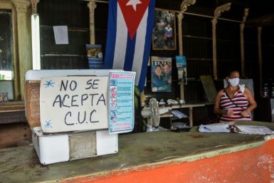 A sign outside a Havana grocery store reads "CUC are not accepted" in September 2020