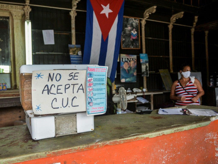 A sign outside a Havana grocery store reads "CUC are not accepted" in September 2020