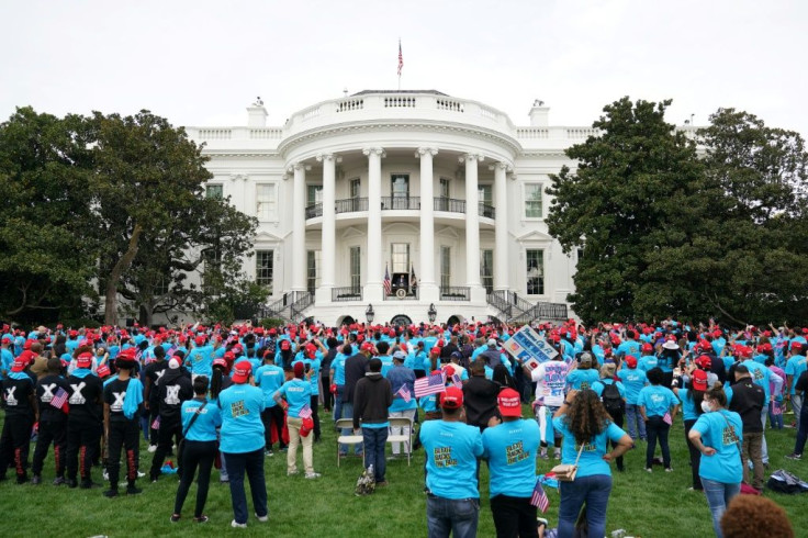 Most people wore masks but there was very little social distancing at the outdoor White House event marking Donald Trump's return to campaigning