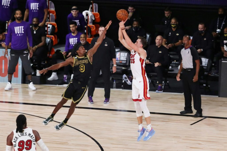 Miami's Duncan Robinson fires a three-pointer over Rajon Rondo in the Heat's game-five victory over the Lakers in the NBA Finals