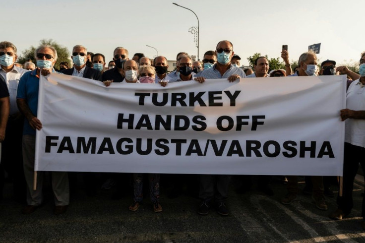 Greek Cypriots protest at the Deryneia crossing point on October 8, 2020 after Turkish troops reopened parts of a Cyprus seaside resort of Varosha