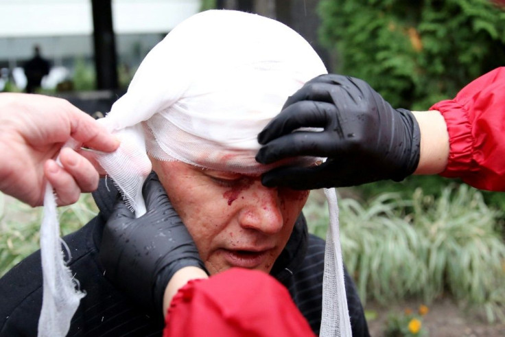 At least one protester's head had to be bandaged after clashes with police in Minsk