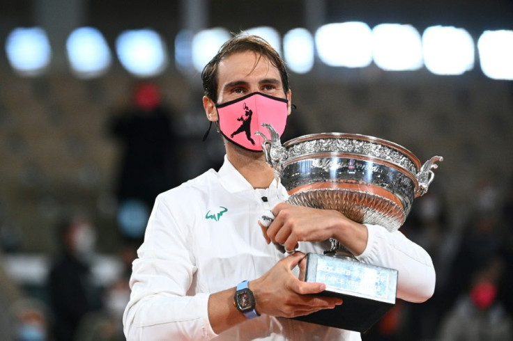 A familiar sight: Rafael Nadal gets his hands on the Coupe des Mousquetaires for a 13th time