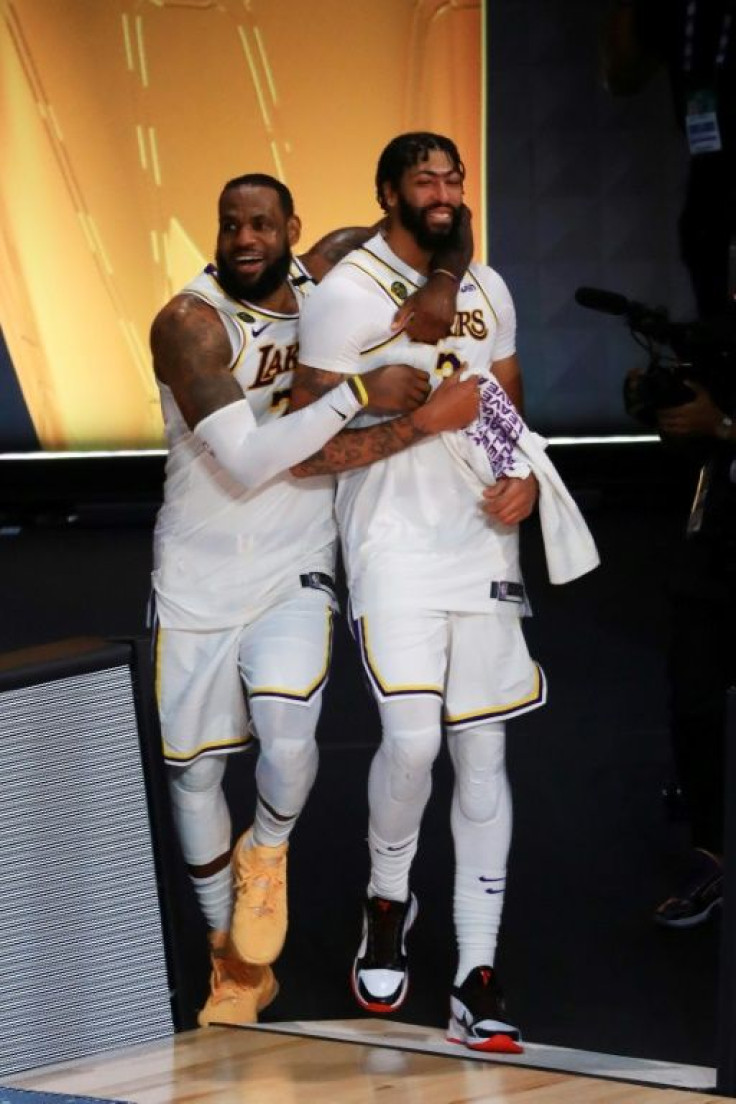 LeBron James and Anthony Davis celebrate the Los Angeles Lakers' title-clinching victory over the Miami Heat in game six of the NBA Finals