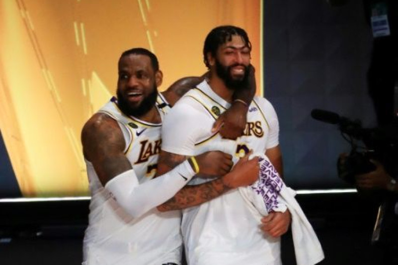 LeBron James and Anthony Davis celebrate the Los Angeles Lakers' title-clinching victory over the Miami Heat in game six of the NBA Finals