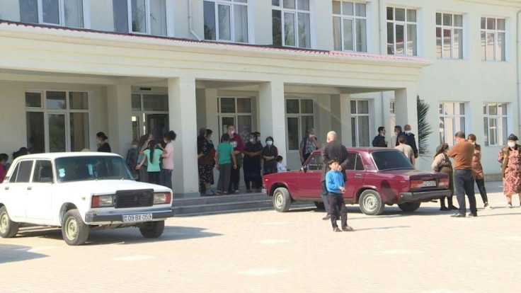 Hundreds of Azerbaijani people who fled fighting in Nagorno-Karabakh have found a new home in a village grammar school