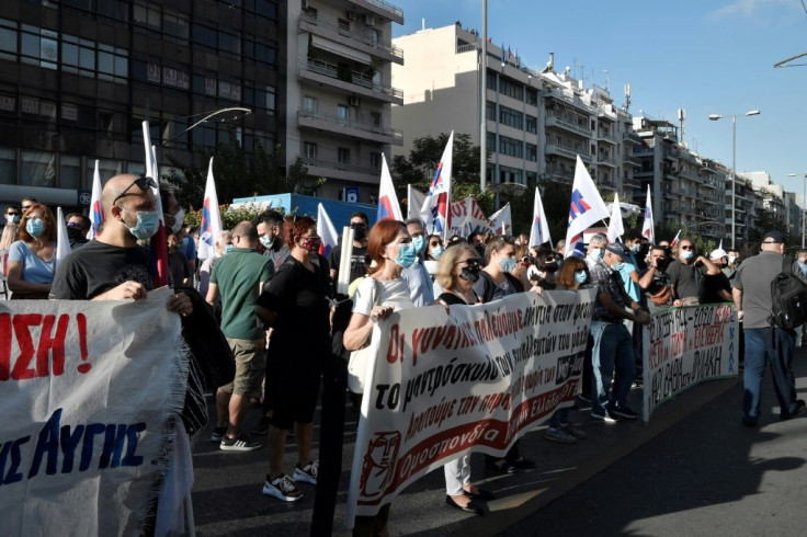 Dozens of protesters gathered outside the court near central Athens