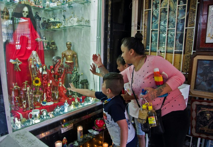 Others indoctrinate their children into the cult of Santa Muerte