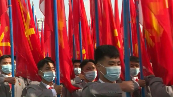 Thousands of North Koreans pack into Pyongyang's Kim Il Sung square to pledge their support for the government -- all of them wearing masks, unlike at a military parade only two days earlier.