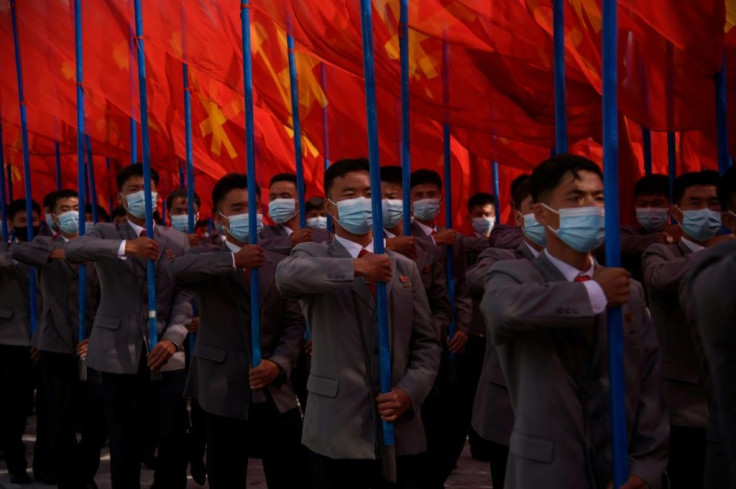 North Koreans rally at the start of an "80-Day Campaign", a mass mobilisation drive to boost the economy ahead of a ruling party congress in January