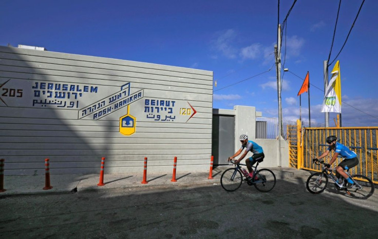 Cyclists turn around at the Israeli side of the Rosh Hanikra Crossing between Israel and Lebanon