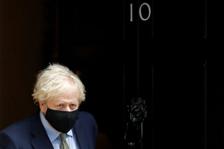Britain's Prime Minister Boris Johnson is under pressure for a temporary lockdown to stop the virus spread