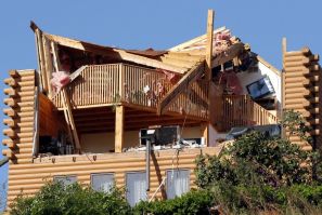 A house is seen damaged after a tornado ripped through on Wednesday in Brimfield