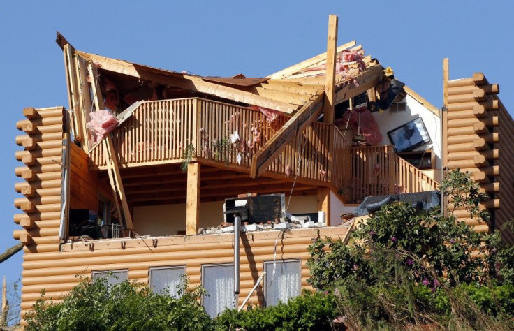A house is seen damaged after a tornado ripped through on Wednesday in Brimfield
