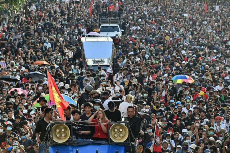 Rung speaks from a truck as pro-democracy protesters march in an anti-government rally in Bangkok on Wednesday