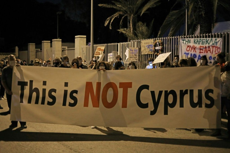 Anti-corruption protesters vent their anger over Al Jazeera's revelations in a demonstration outside the Cyriot parliament