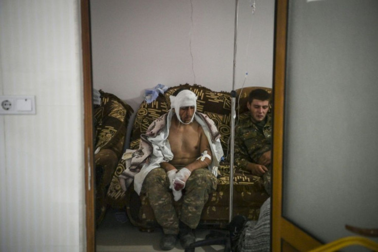A soldier is treated in a hospital in Karabakh where the injured sometimes form a queue for the operating theatre
