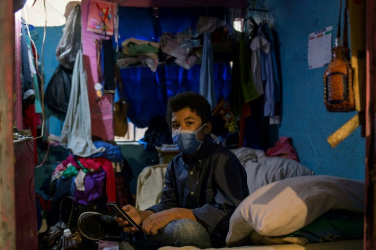Jonathan Figueroa, 14, in the room he shares with his mother in the Bello Campo district of Caracas, in October 2020