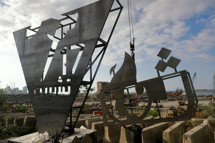 Lebanese activists erect a monument close to the site of a devastating August explosion in Beirut port to mark the first anniverary of nationwide protests for sweeping political reform
