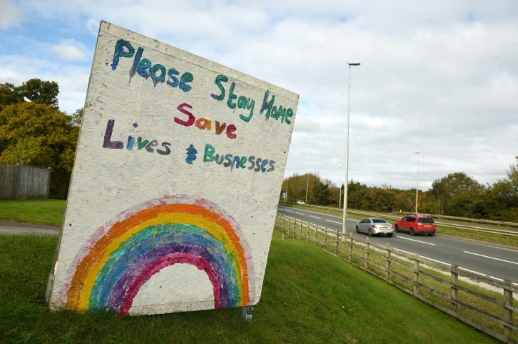 A sign outside a pub in Wales asks people to do their bit and "stay home" -- Wales plans to prevent people entering from other UK  hotspots