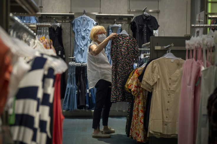 A woman wearing a facemask shops in Montreal, Canada, during the coronavirus pandemic