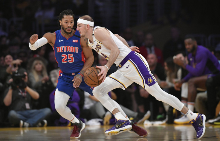  Derrick Rose #25 of the Detroit Pistons guards Alex Caruso #4 of the Los Angeles Lakers 