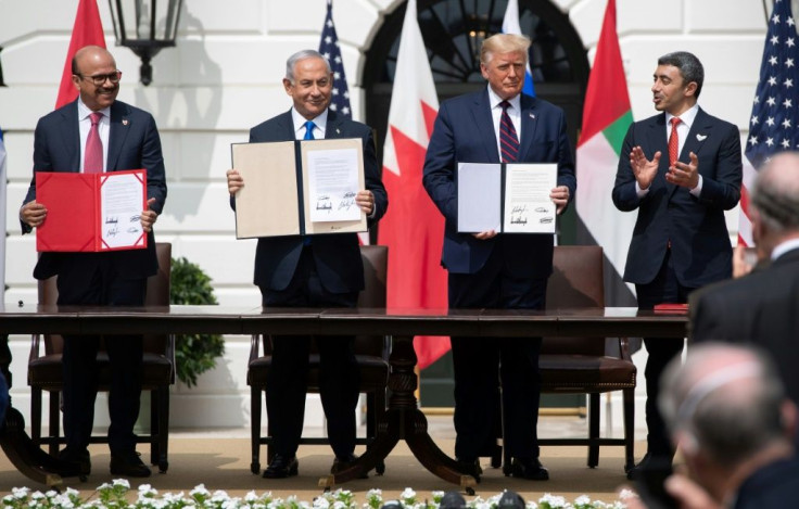 (L-R) Bahrain Foreign Minister Abdullatif al-Zayani, Israeli Prime Minister Benjamin Netanyahu, US President Donald Trump, and UAE Foreign Minister Abdullah bin Zayed Al-Nahyan signed the 'Abraham Accords' at the White House in September