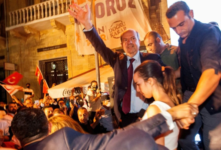 Turkish Cypriot right-wing leader Ersin Tatar (C) celebrates with supporters in northern Nicosia after winning the presidential election in the self-declared Turkish Republic of Northern Cyprus