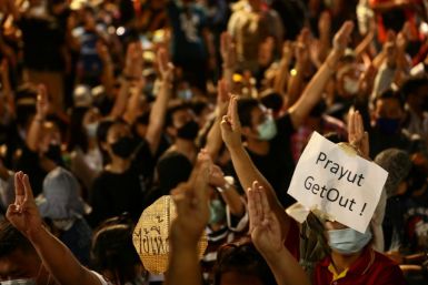 Protesters display a sign calling for the resignation of Thailand's prime minister at a rally in Bangkok