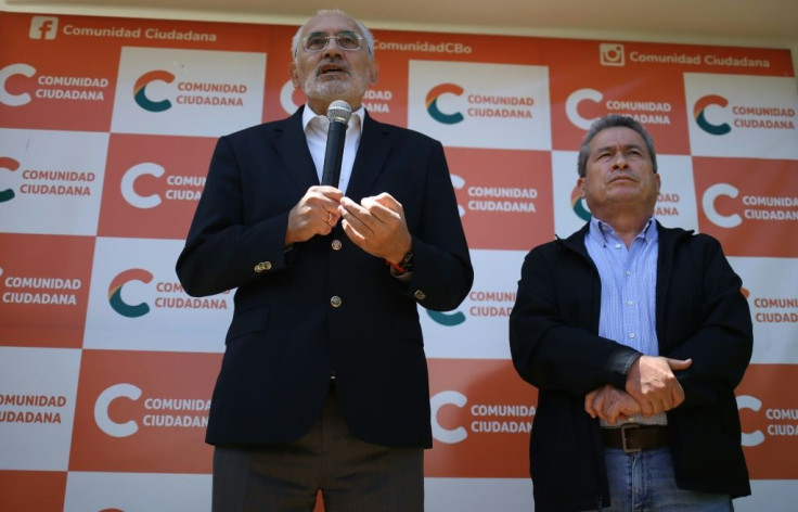 Bolivia's centrist presidential candidate, former president (2003-2005) Carlos Mesa (L), conceded after exit polls showed he had been soundly defeated