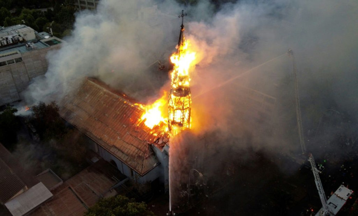 Aerial view of the church of the Assumption in flames after violence broke out during protests in Santiago Sunday