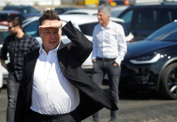 Tesla CEO Elon Musk gestures as he arrives to visit the construction site of the future US electric car giant in Gruenheide near Berlin in September